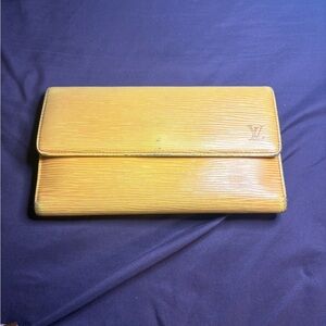 Louis Vuitton Epi wallet in yellow.